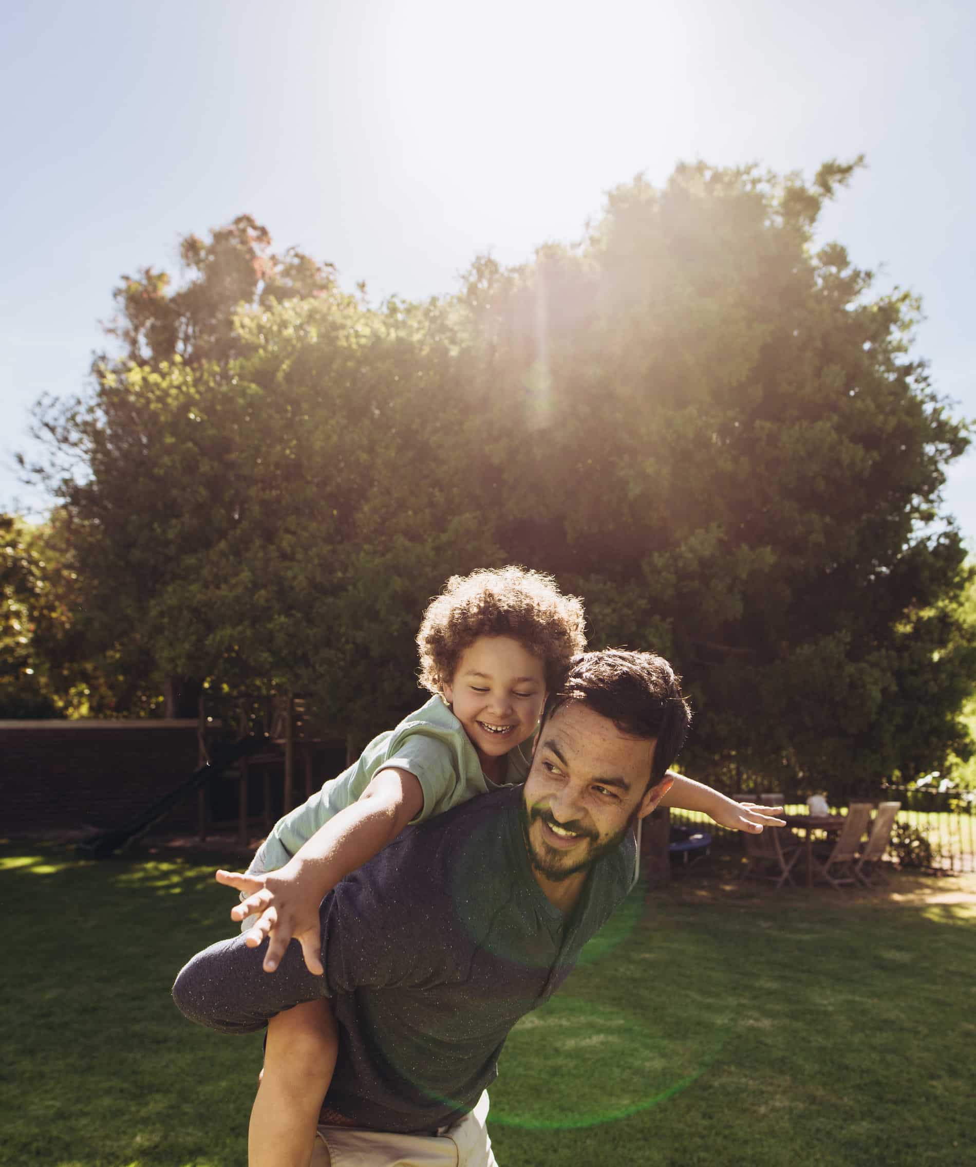 Happy man and his son play after functional medicine in Charlotte, NC