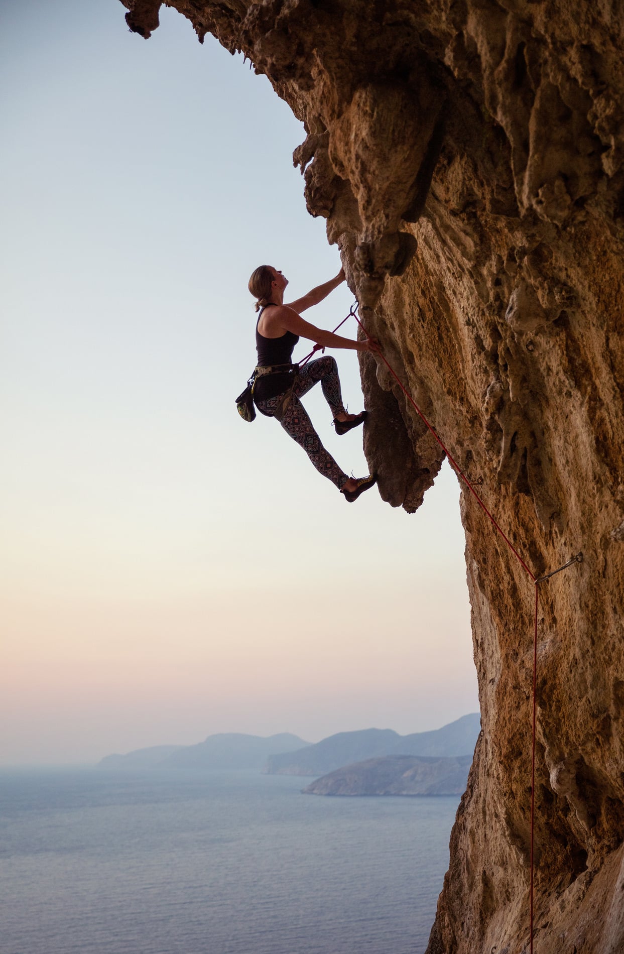 Woman climbing with energy after IV therapy in Charlotte NC