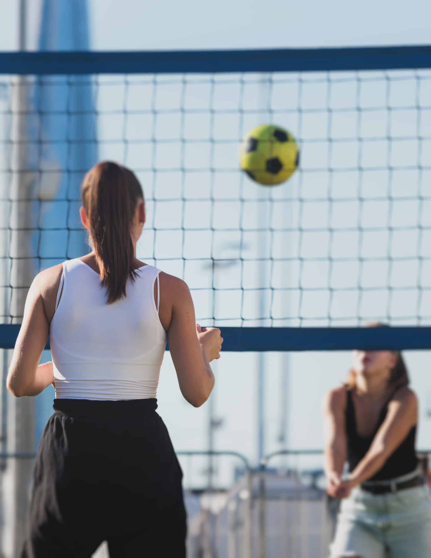 Woman playing volloeyball on their way to an IV therapy clinic in Charlotte NC