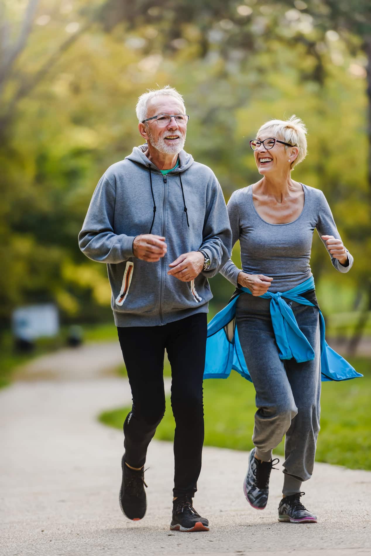 Older couple exercising together after medical ozone therapy at Heritage Regenerative Medicine