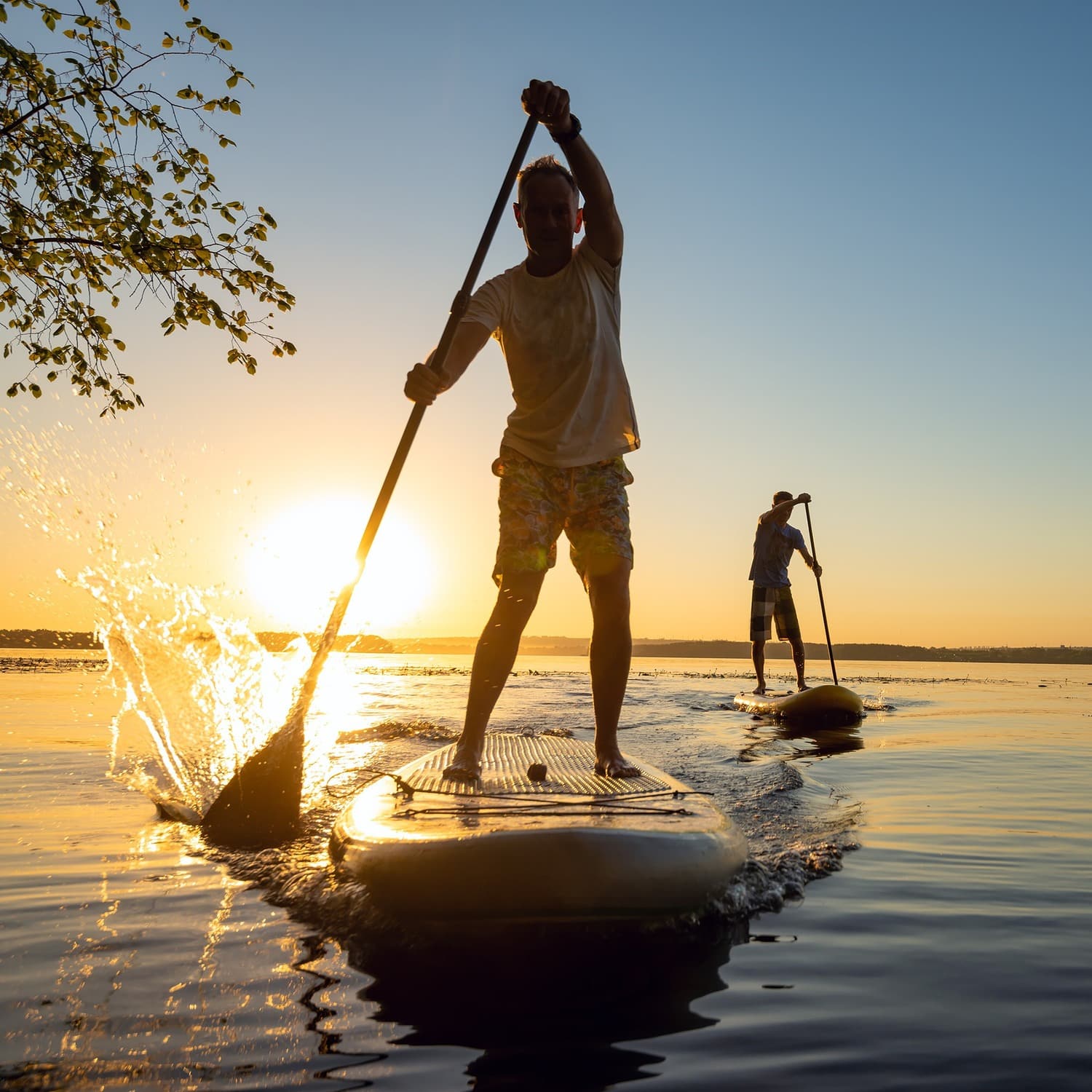 AdobeStock_211173914 v2 Man paddle boarding without pain after a Pepetide Injection in Charlotte NC