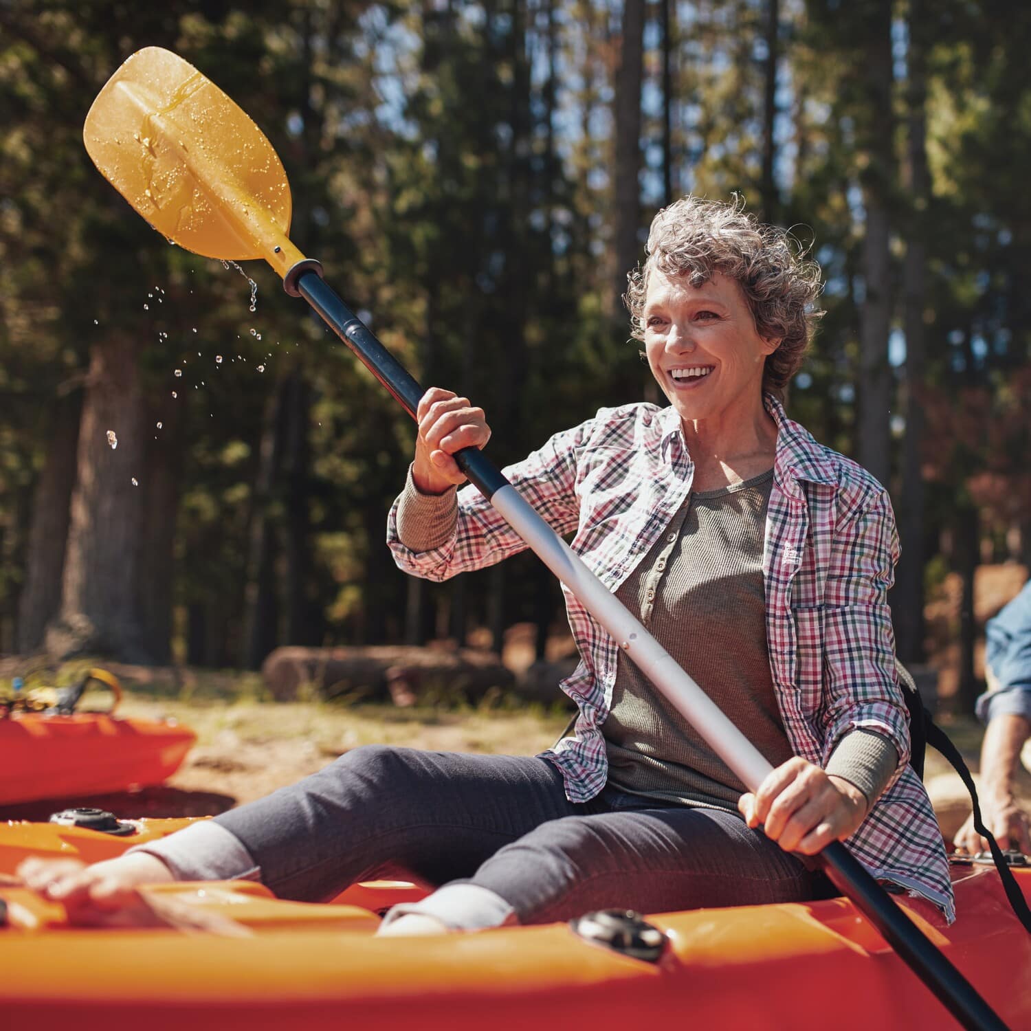 Woman kayaks freely with the help og Neuropathy Treatment in Charlotte